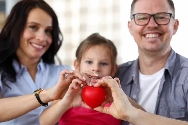 depositphotos_361527036-stock-photo-smiling-parents-with-kid